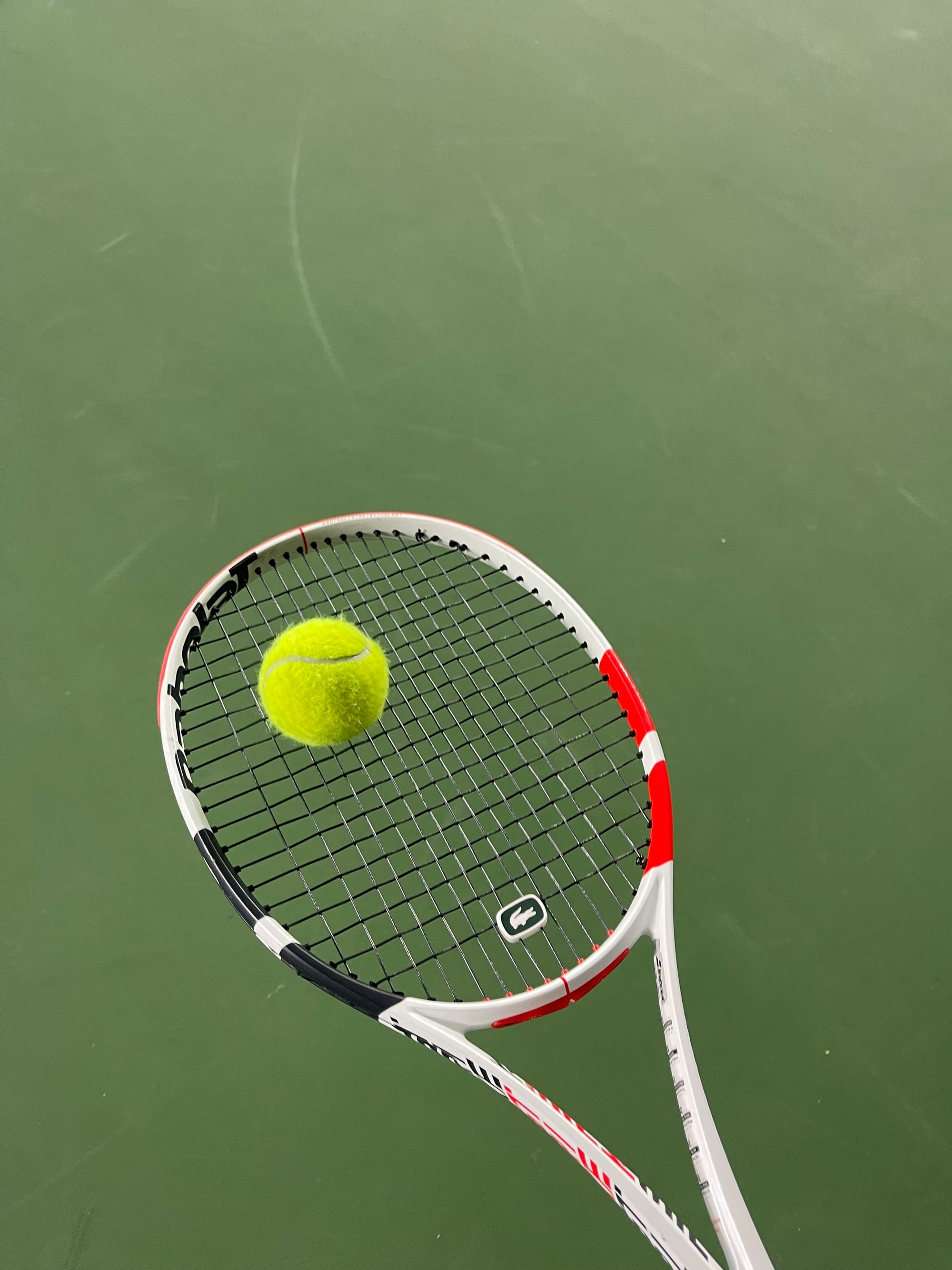 A young player practicing forehand